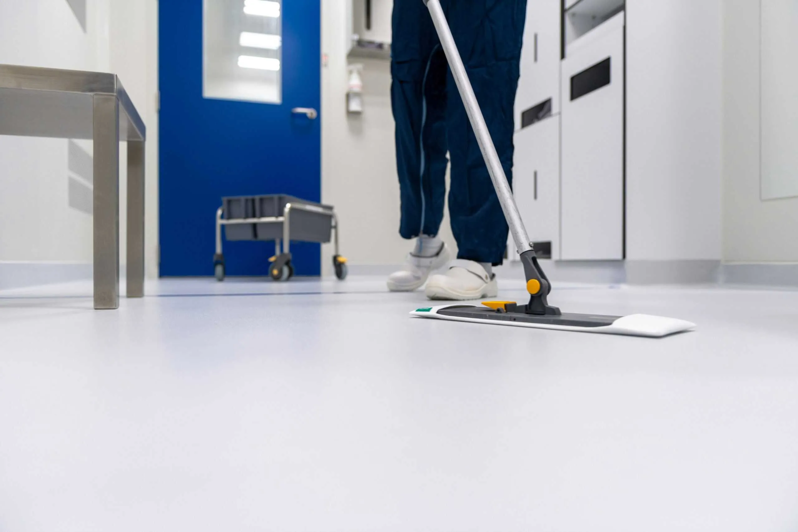 Professional janitorial floor cleaning in a commercial facility.