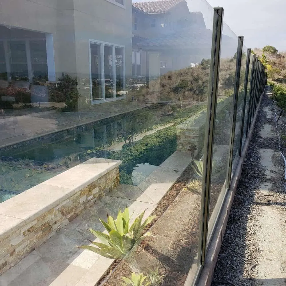 Clear glass pool fencing for enhanced safety and stylish outdoor design.