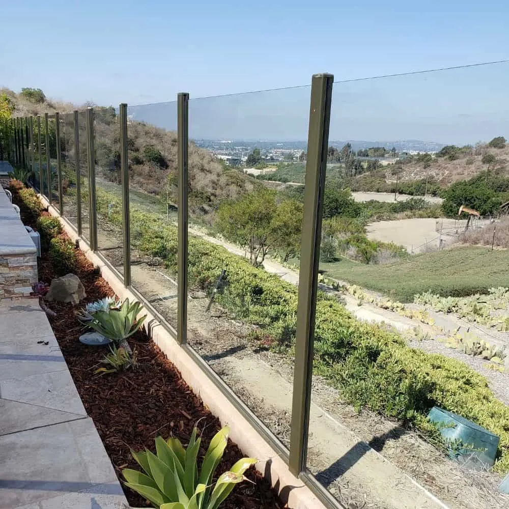 Elegant glass fencing enhances safety and aesthetics in outdoor spaces.